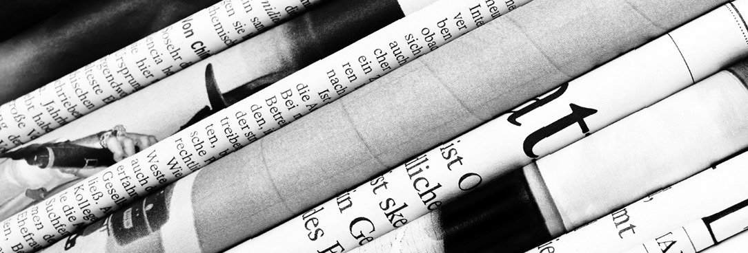 Media releases black and white photo of newspapers